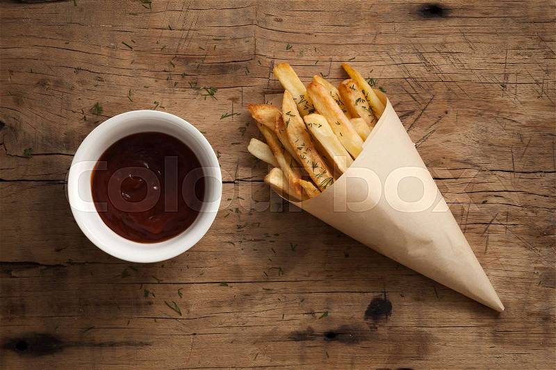 Fries french ketchup still life flat lay dill herb salt junk fastfood wood background, stock photo