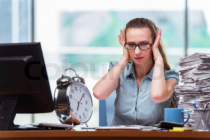 Woman businesswoman failing to meet her deadlines, stock photo