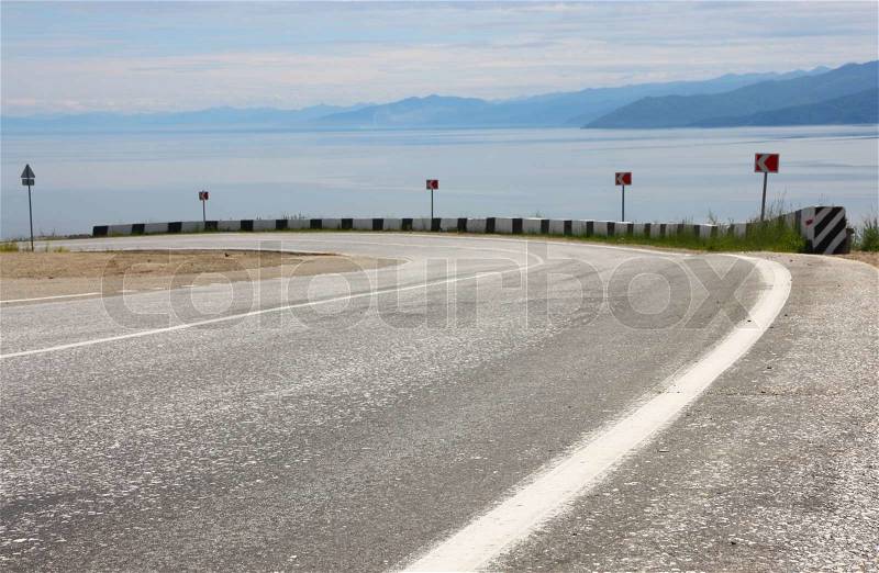 Asphalt road and sky with clouds, stock photo