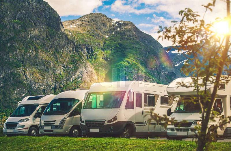 Scenic RV Park Camping. Few Camper Vans in Remote Location. RVing Theme, stock photo