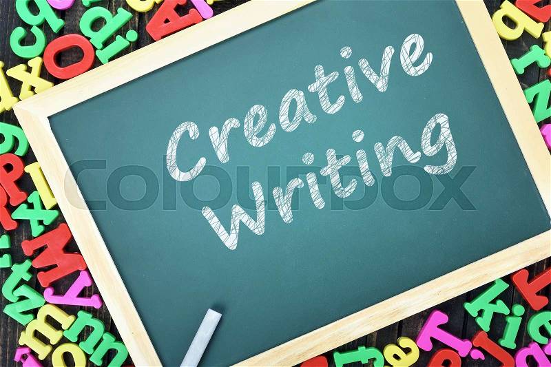 Creative Writing text on school board and magnetic letters, stock photo