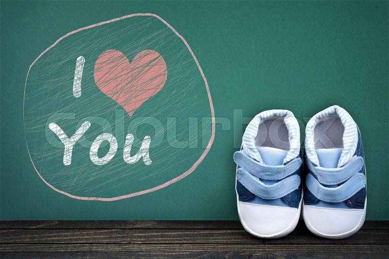 I love you text on school table and kid shoes, stock photo