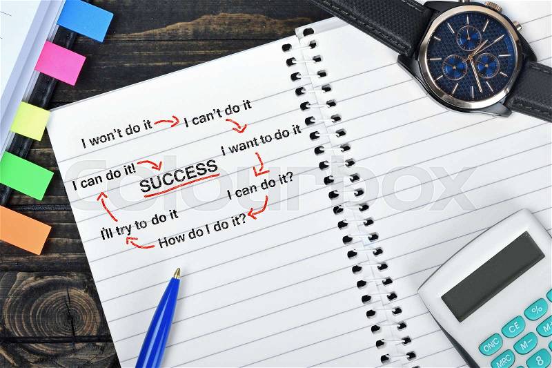 Success Scheme on notepad and watch on desk, stock photo