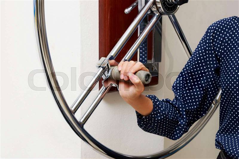 Woman doing rehab exercise with shoulder wheel, physical therapy rehabilitation, stock photo