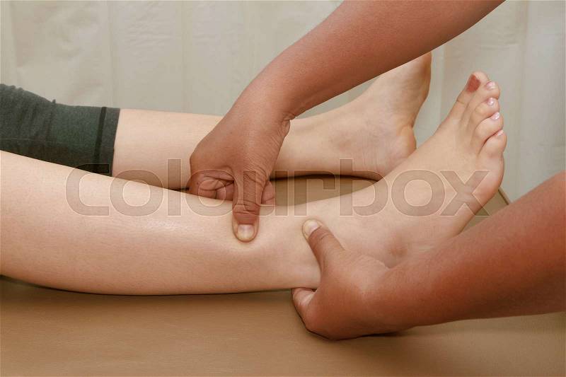 Thai reflexology foot massage, foot spa treatment, stock photo