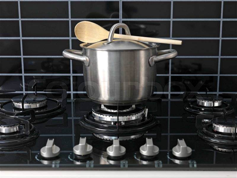A stainless steel pot on a cook top, A stainless steel pot on a cook top, stock photo