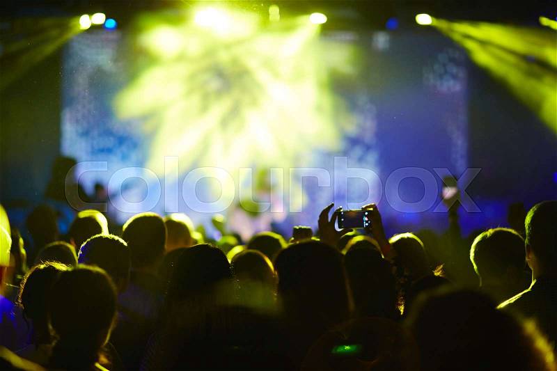 Crowd at concert and blurred stage lights, stock photo