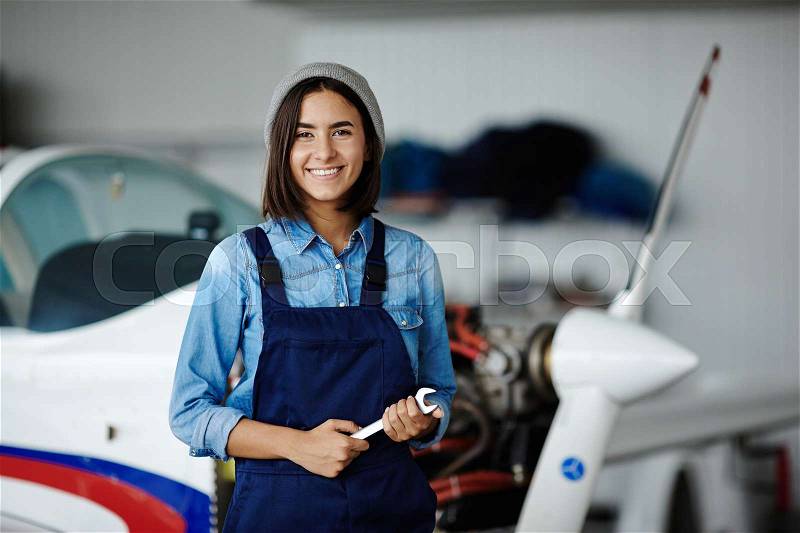 Happy worker of engineering service looking at camera, stock photo