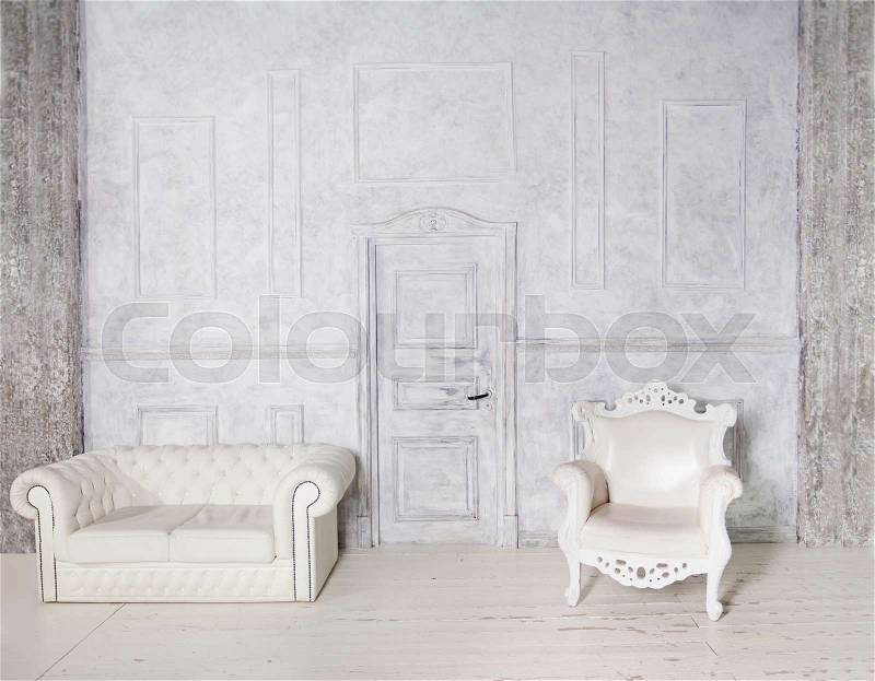 Vintage Interior with Sofa, Armchair, Stucco Wall and Door, Gray Background, stock photo