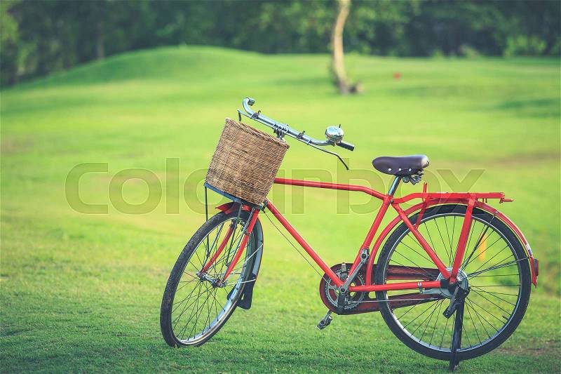 Red Japan style classic bicycle at the park, Vintage filter effect, stock photo