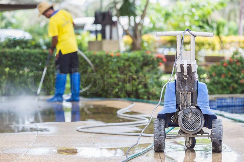 Close up Outdoor floor cleaning with high pressure water jet, stock photo