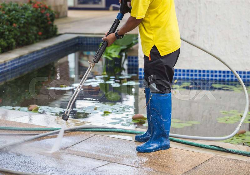 Close up Outdoor floor cleaning with high pressure water jet, stock photo