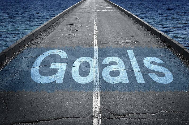Goals message on empty road, stock photo