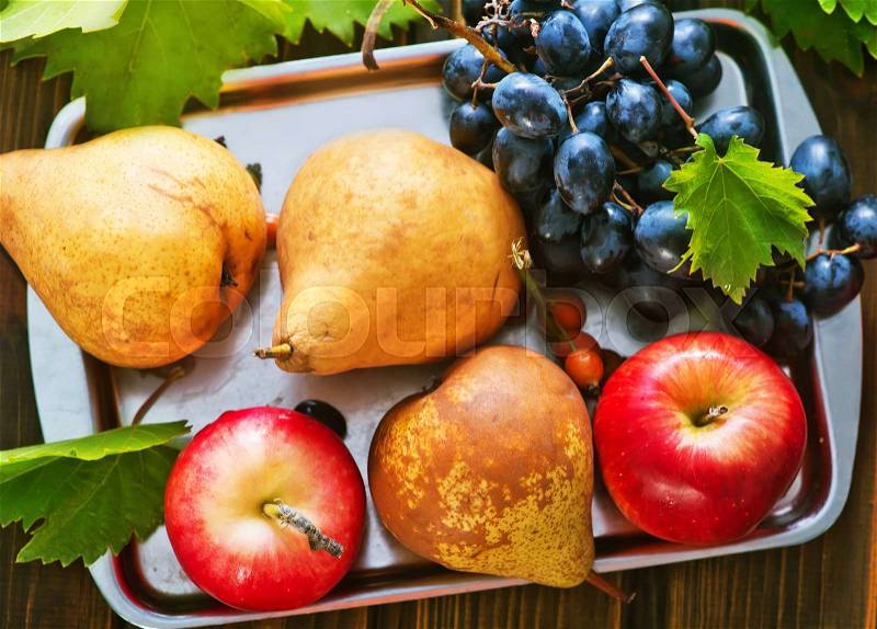 Autumn fruits on the wooden table, autumn harvest, stock photo