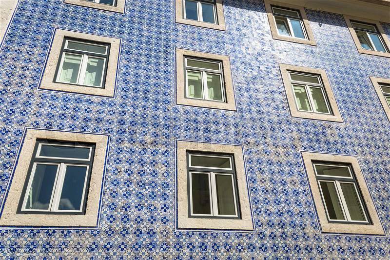 Lisbon buildings with typical traditional portuguese tiles on the wall in Lisbon, Portugal, stock photo