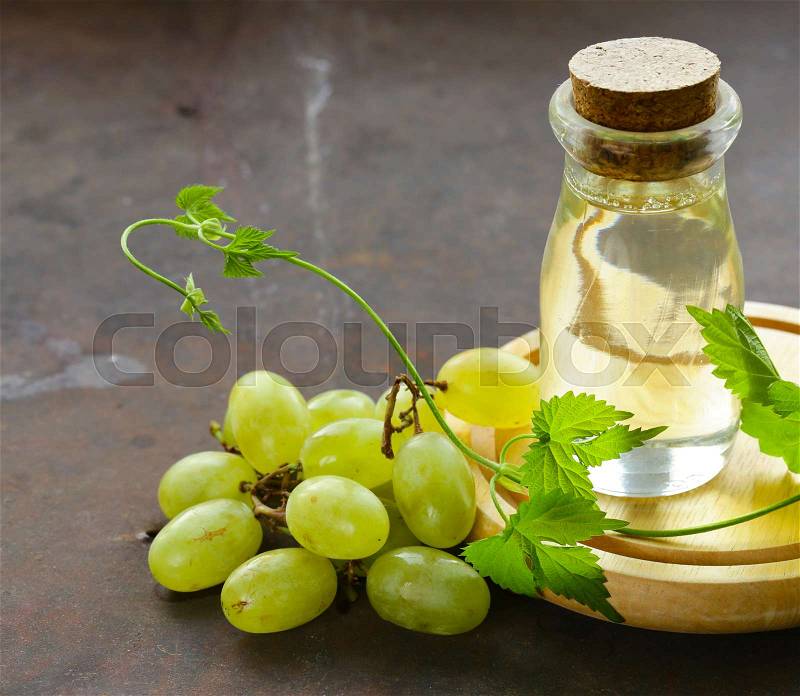 Grape seed oil in a glass bottle, healthy food, stock photo