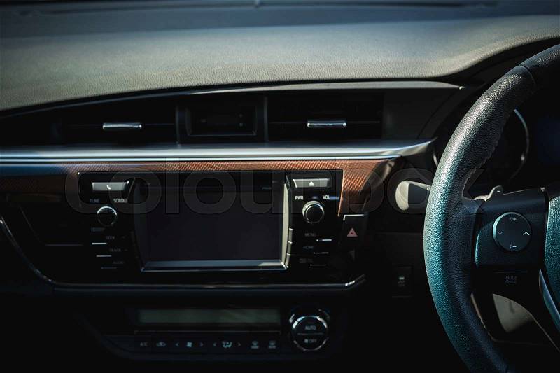 Detail of new modern car interior, Focus on steering, stock photo