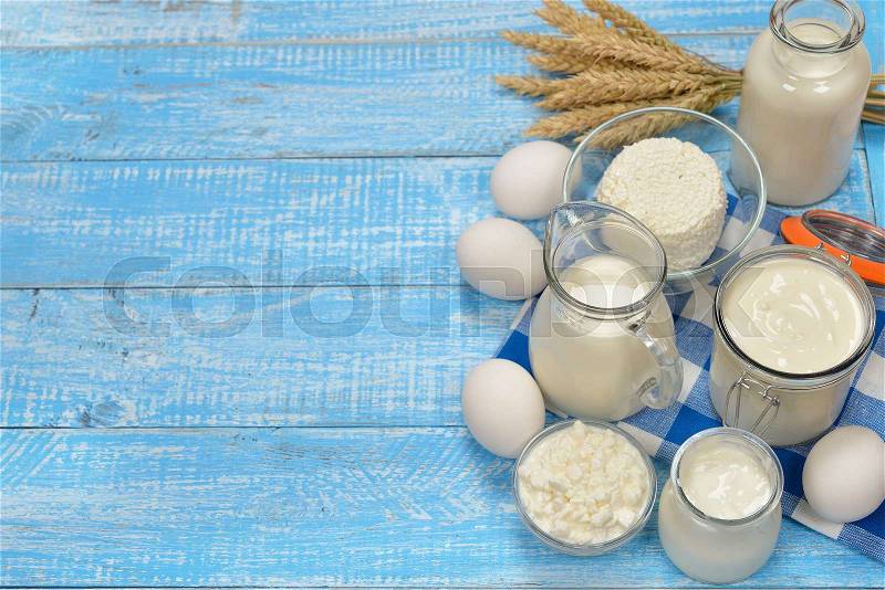 Fresh dairy products on a blue background, stock photo