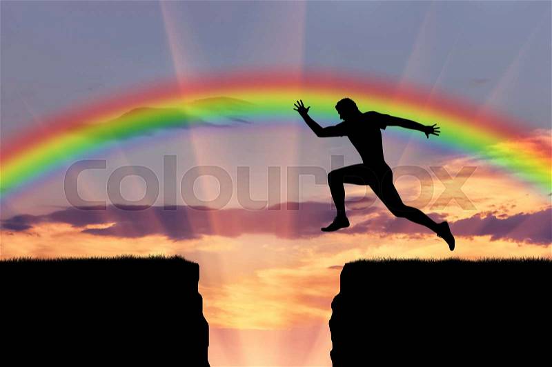 Jump runner athlete. Runner jumps over a precipice on the background of the rainbow, stock photo