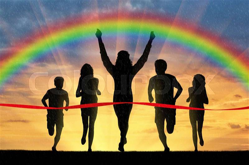 Runners, rainbow, sport. Winning runner crosses the red tape on the background of the rainbow, stock photo