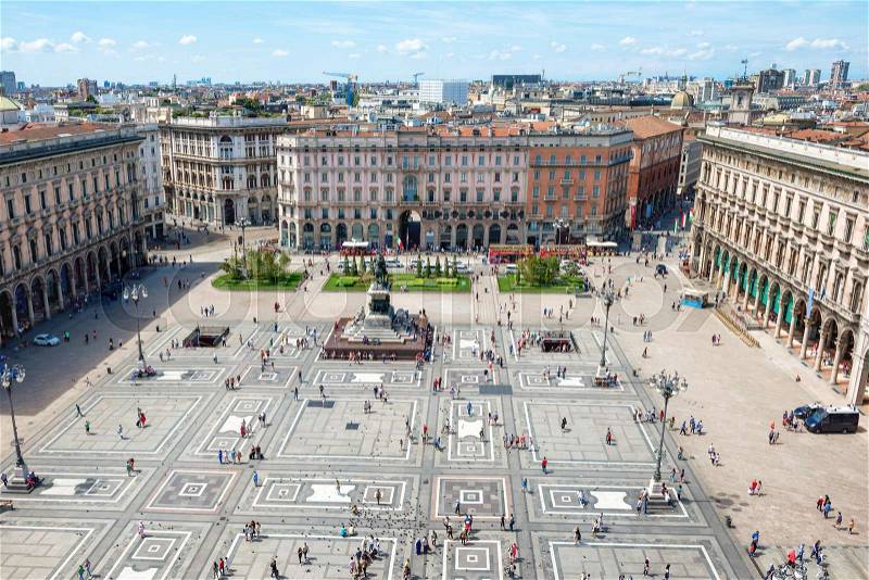 Aerial view of square from roof of famous Cathedral Duomo di Milano on piazza in Milan, Italy , stock photo