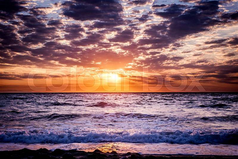 Beautiful sun and sky over the sea in long exposure, stock photo