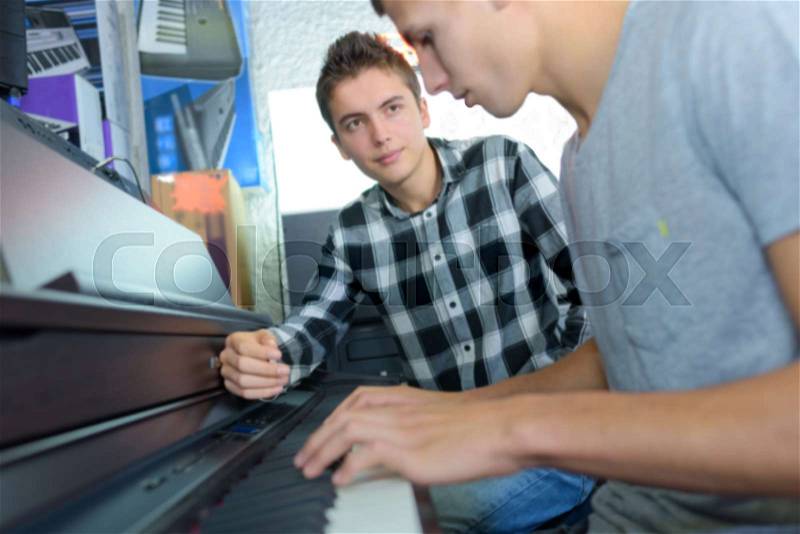 In the piano lesson, stock photo