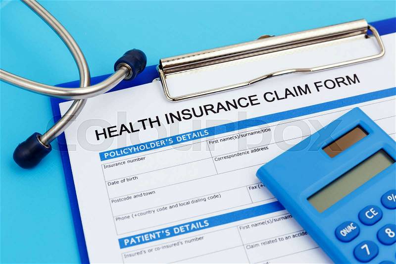 Health insurance claim form with calculator and stethoscope, stock photo