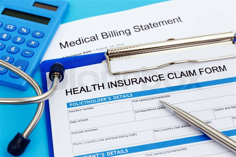Health insurance claim form with stethoscope and calculator, stock photo