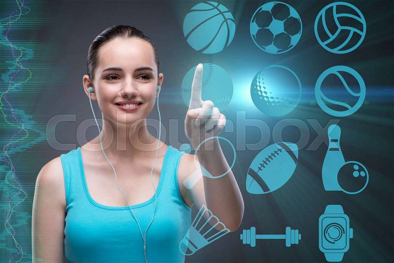 Young girl in sports concept pressing virtual buttons, stock photo