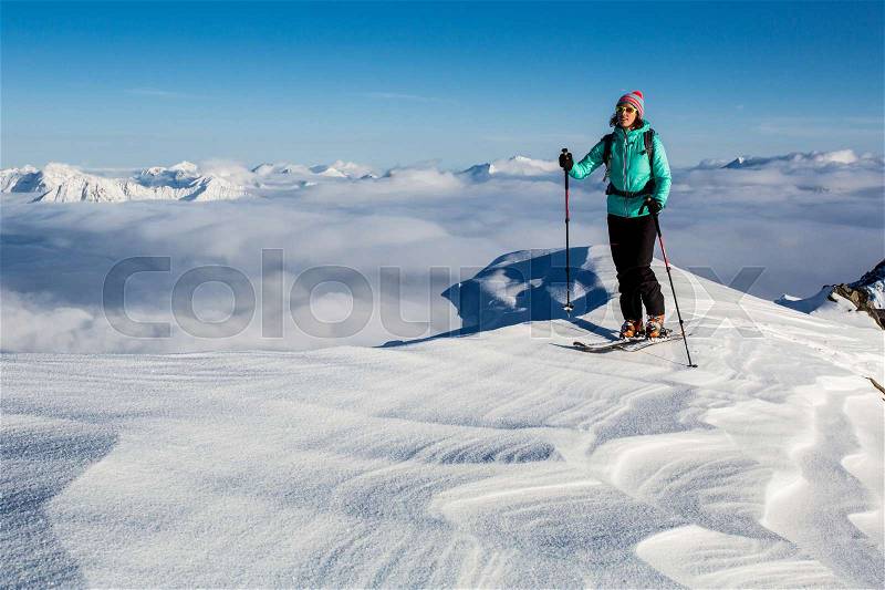 Young woman enjoying ski touring hike, stock photo