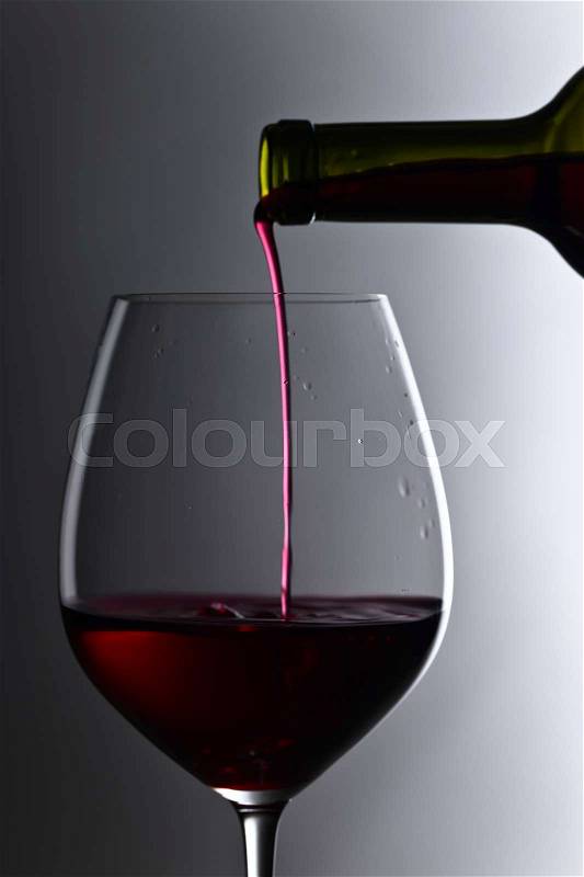 Silhouette of bottle and glass of red wine, stock photo