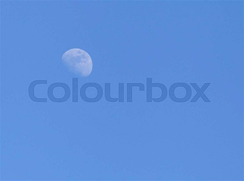The Moon in a blue sky, stock photo