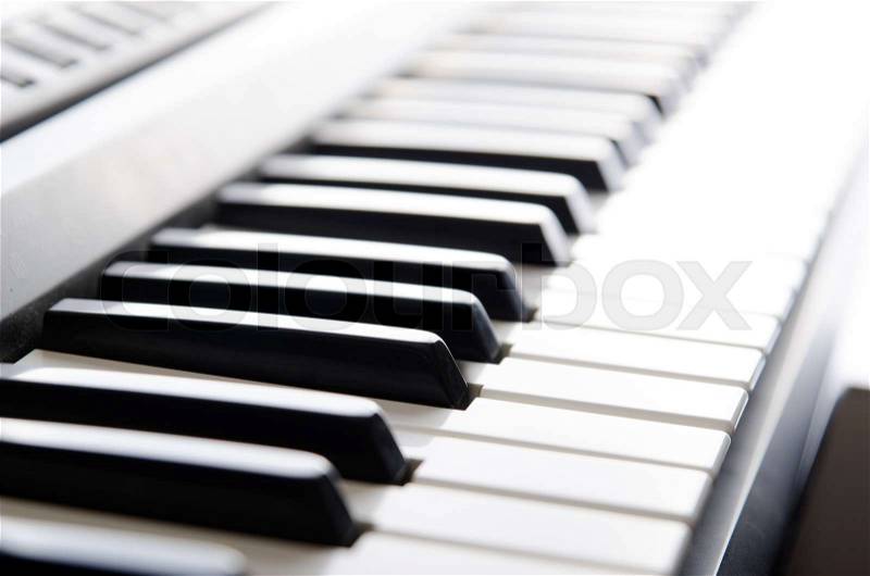 Piano keys of electronic keyboard instrument. Close up photo, stock photo