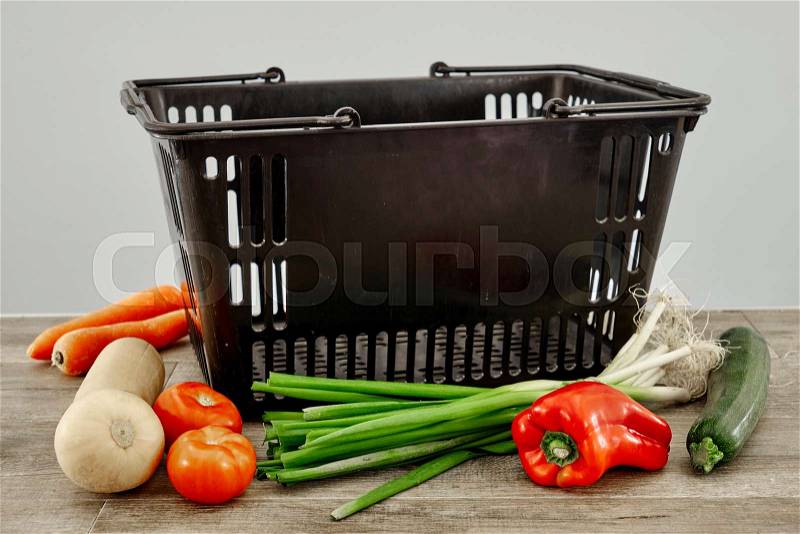 A studio photo of a fruit and vegetable basket, stock photo
