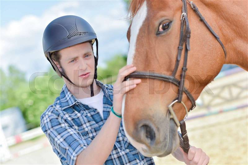 Young man with horse, stock photo