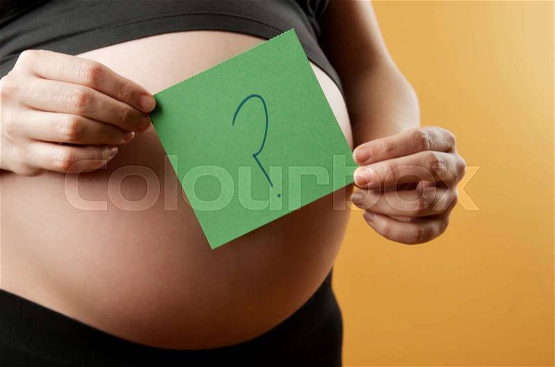 Pregnant mother wondering when your baby is born, stock photo