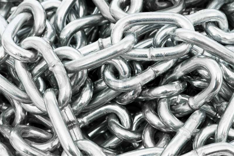 Long silver chain arranged as the background, stock photo