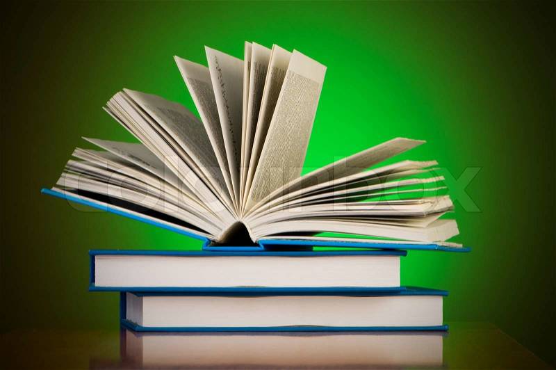 Stack of books against gradient background, stock photo