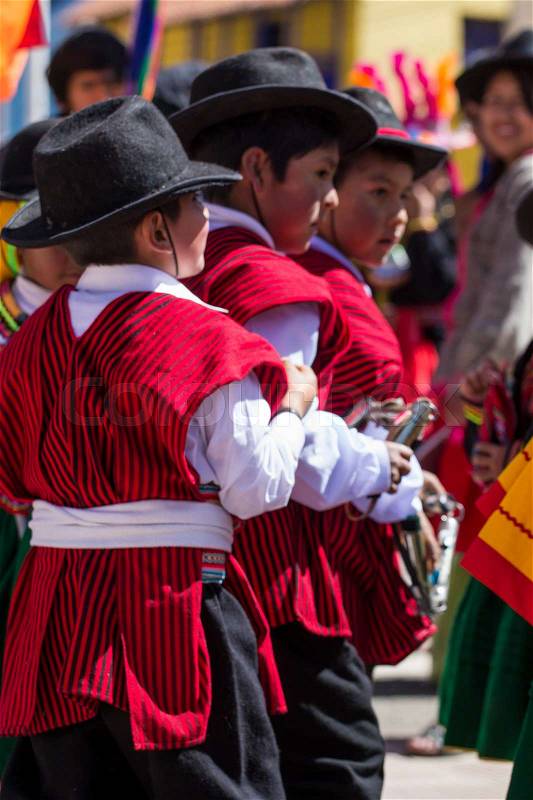 Puno, Peru - August 20, 2016: Native people from peruvian city dressed in colorful clothing perform traditional dance in a religious celebration. Peru, South America, stock photo