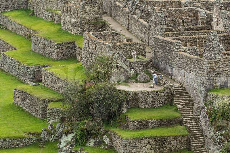 View of the ancient Inca City of Machu Picchu. The 15-th century Inca site.'Lost city of the Incas'. Ruins of the Machu Picchu sanctuary. UNESCO World Heritage site.Peru, stock photo