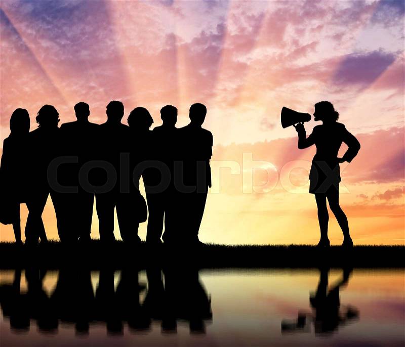 Megaphone. Speaker in the woman\'s hand. Speech for the crowds, stock photo