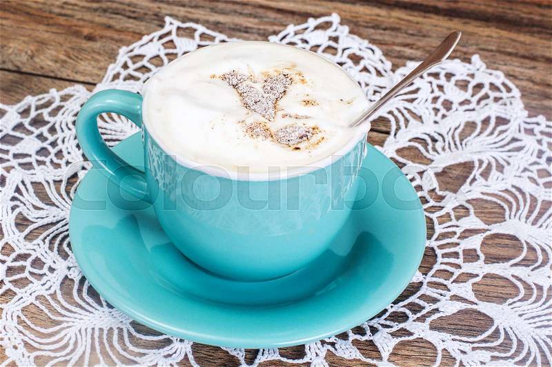 Coffee with Milk, Cappuccino in a Blue Retro Cup. Studio Photo, stock photo