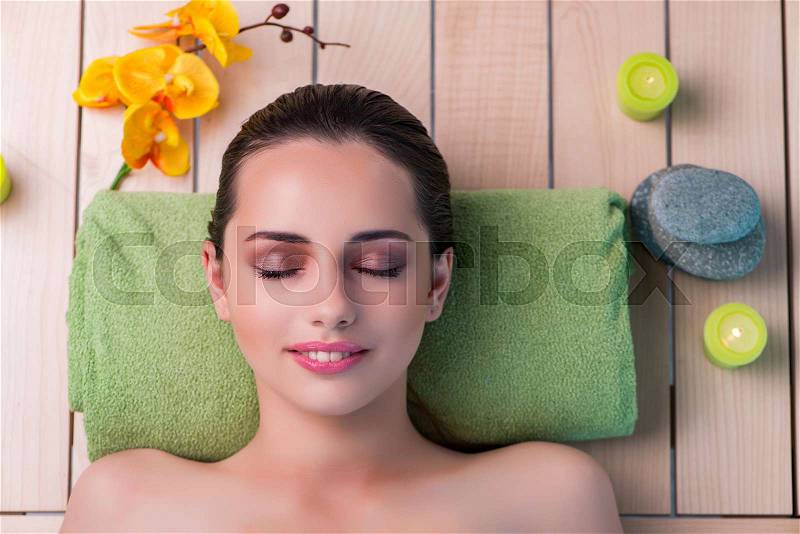 Young beautiful woman during spa procedure, stock photo