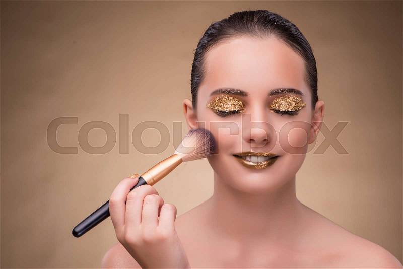 Woman during cosmetics session in fashion concept, stock photo