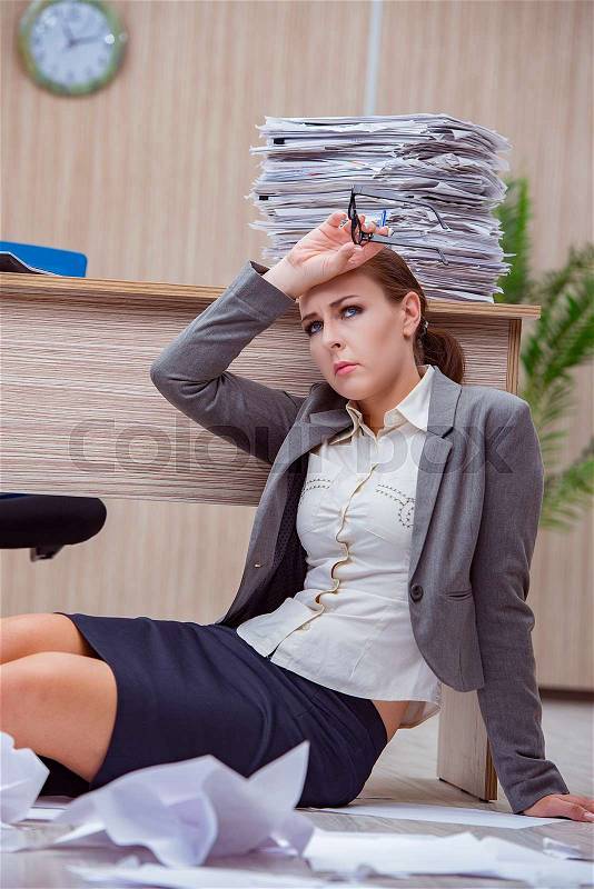 Busy stressful woman secretary under stress in the office, stock photo