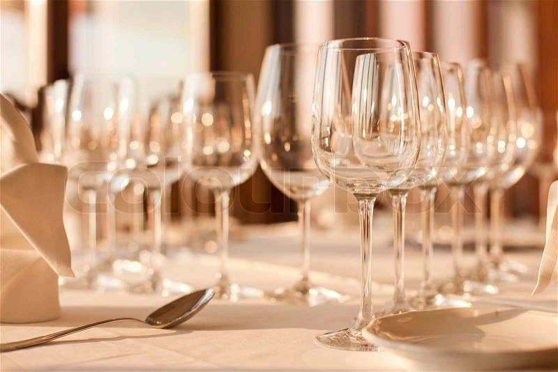 Wine glasses stand in a row on the table, stock photo