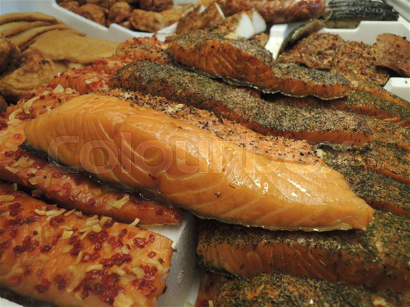 Assorted selection of smoked fish in fish shop, stock photo