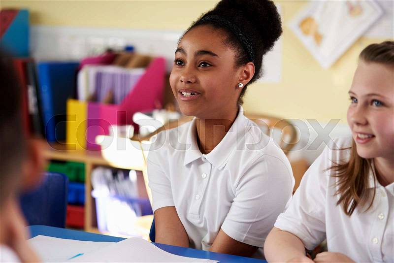 Two primary school girls in class, close up, stock photo