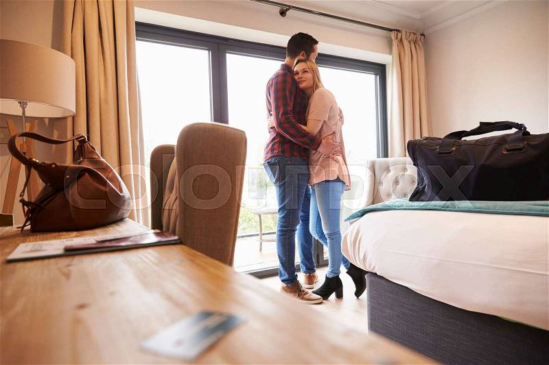 Romantic Couple With Hotel Room Key In Foreground, stock photo